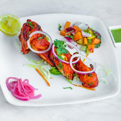 Grilled half chicken marinated in yogurt and spices