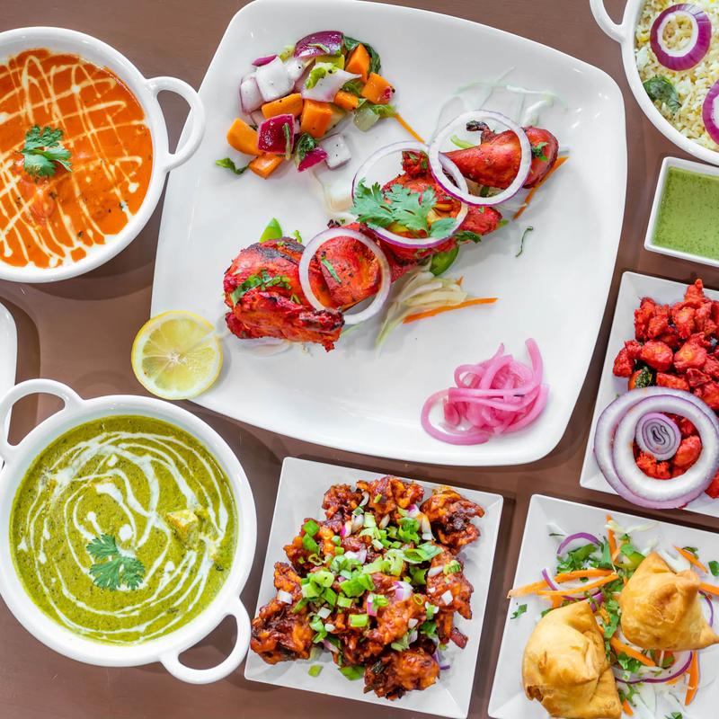 Assorted dishes on the table at Tandoori Lounge