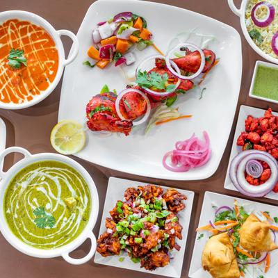Assorted dishes on the table at Tandoori Lounge